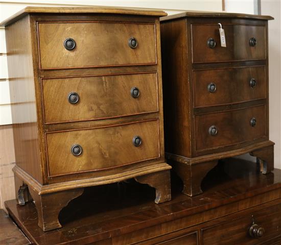 A pair of serpentine mahogany bedside chests W.51cm
